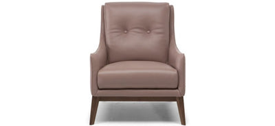 Dusty pink leather Natuzzi Amicizia armchair, with oak wooden legs on a plain white background